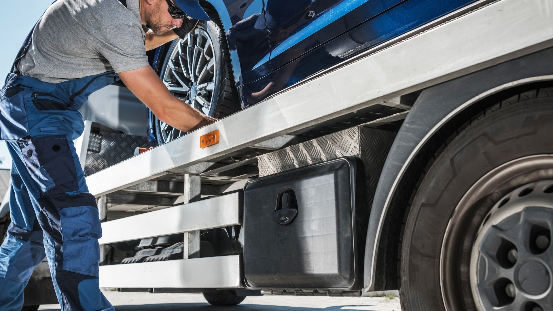 Mechanic checking truck tire and wheel during vehicle maintenance